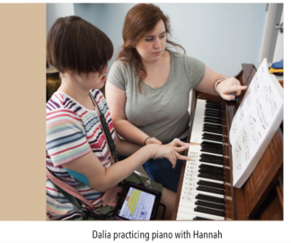 PHOTO OF DALIA PRACTICING PIANO WITH HANNAH