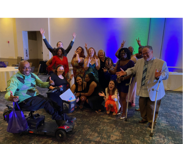 Self advocates who are involved with disABILITY Link take a photo at a local awards banquet.